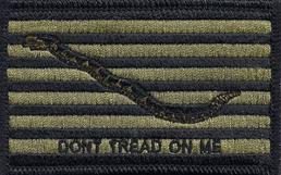 A patch displays a coiled snake on horizontal green and black stripes with the text "Don't Tread On Me" below.